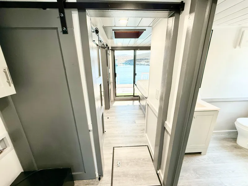 Slide: The Image of Interior of 1987 Three Buoys 5014 houseboat with modern decor and lake view. - 19