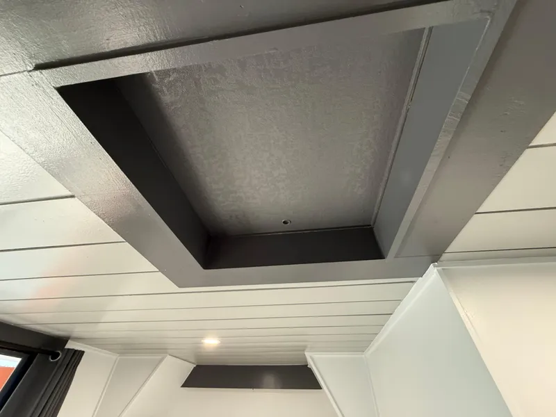 Slide: The Image of Ceiling view of 1987 Three Buoys 5014 houseboat interior with recessed lighting. - 21