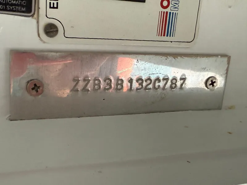 Slide: The Image of VIN plate on a 1987 Three Buoys 5014 boat, displaying serial number ZZB3B132C787. - 38