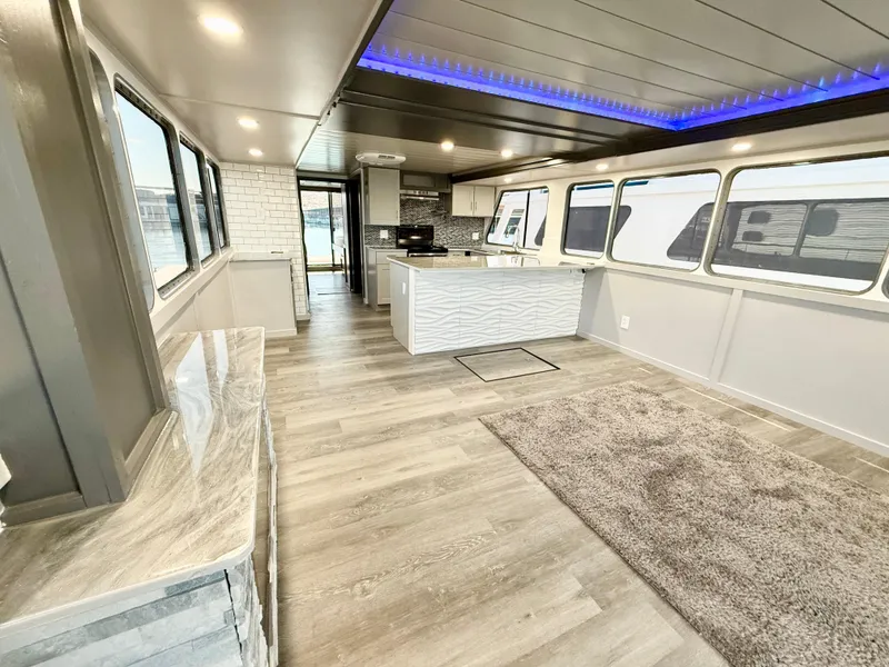 Slide: The Image of Luxurious interior of 1987 Three Buoys 5014 houseboat with modern kitchen and spacious layout. - 4
