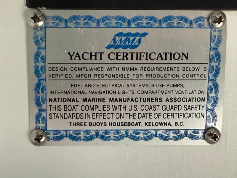 Slide: The Image of Yacht certification plaque for 1987 Three Buoys 5014, verifying NMMA compliance and safety standards. - 40