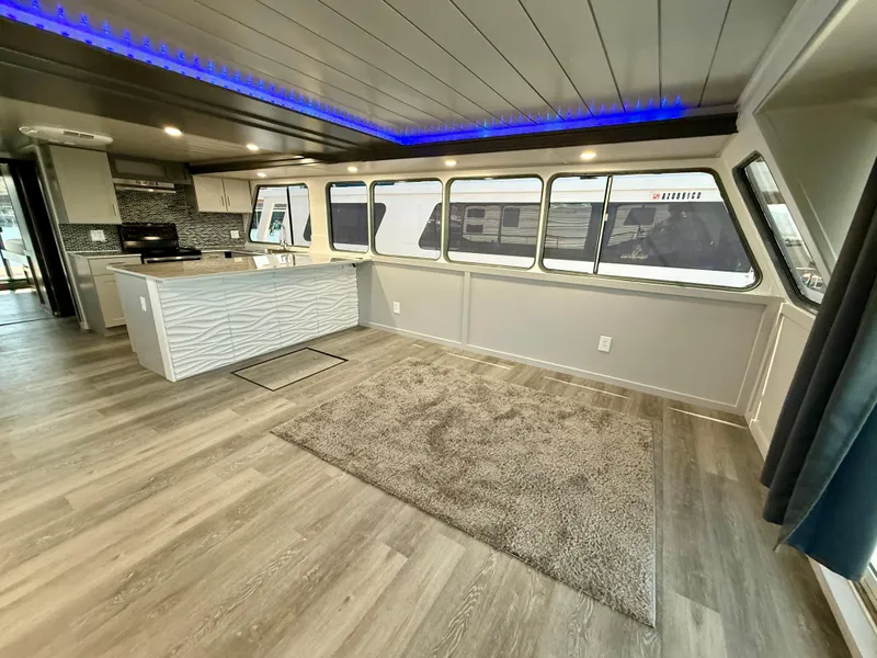 Slide: The Image of Modern interior of 1987 Three Buoys 5014 houseboat with kitchen and large windows. - 5