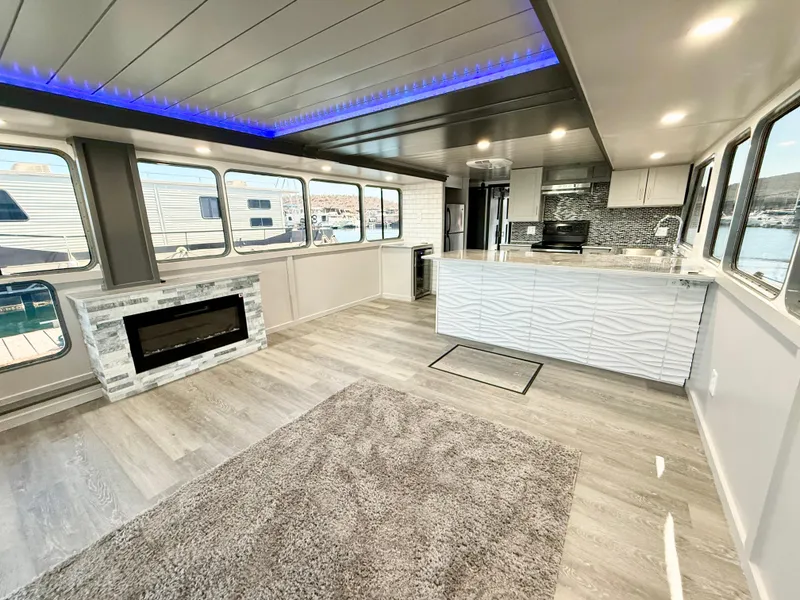 Slide: The Image of Modern interior of 1987 Three Buoys 5014 houseboat with stylish kitchen and fireplace. - 7