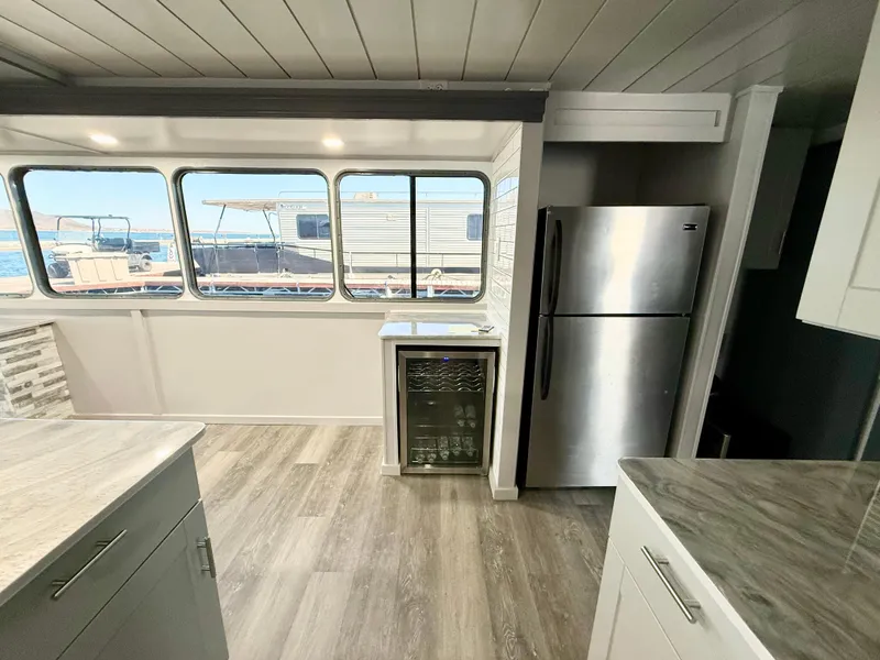Slide: The Image of Modern kitchen interior on 1987 Three Buoys 5014 houseboat with stainless steel appliances. - 9