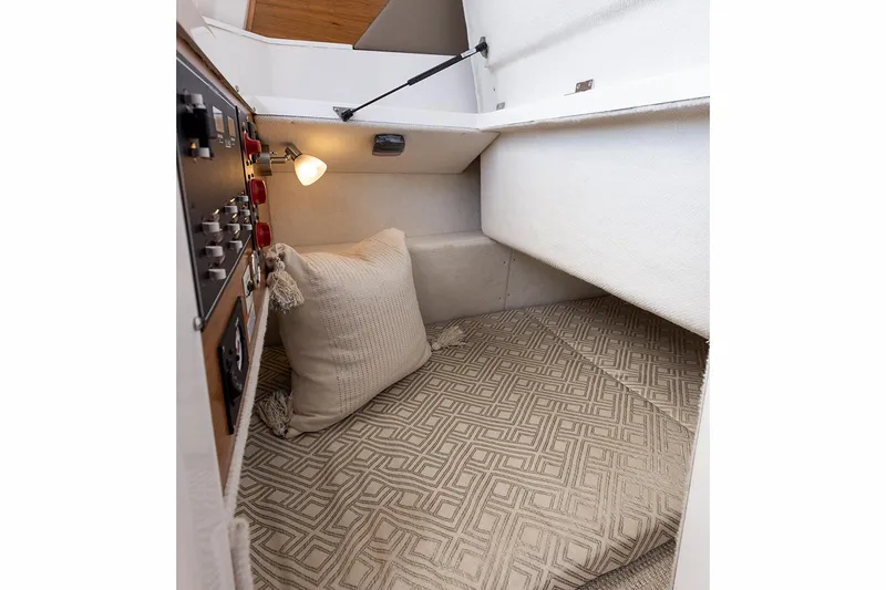 Slide: The Image of Manufacturer Provided Image: 2022 Cutwater C-248 Coupe cabin interior with cozy bed and control panel. - 14