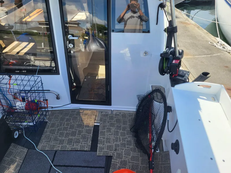 Slide: The Image of 2022 Cutwater C-248 Coupe boat interior with fishing gear and equipment. - 3