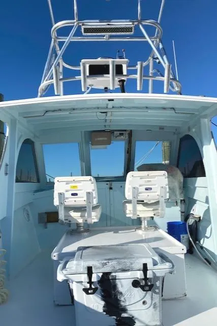 Slide: The Image of 1975 Custom Carolina Warren O'Neal boat interior with dual seats and equipment. - 10