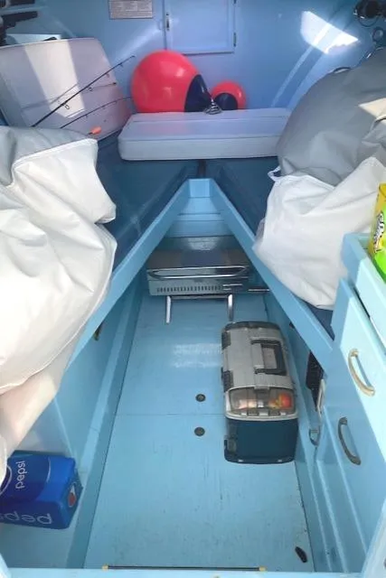 Slide: The Image of Interior of a 1975 Custom Carolina Warren O'Neal boat with storage and seating. - 16