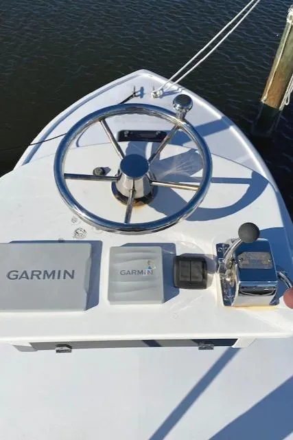 Slide: The Image of Steering wheel and controls of 1975 Custom Carolina Warren O'Neal boat with Garmin equipment. - 19
