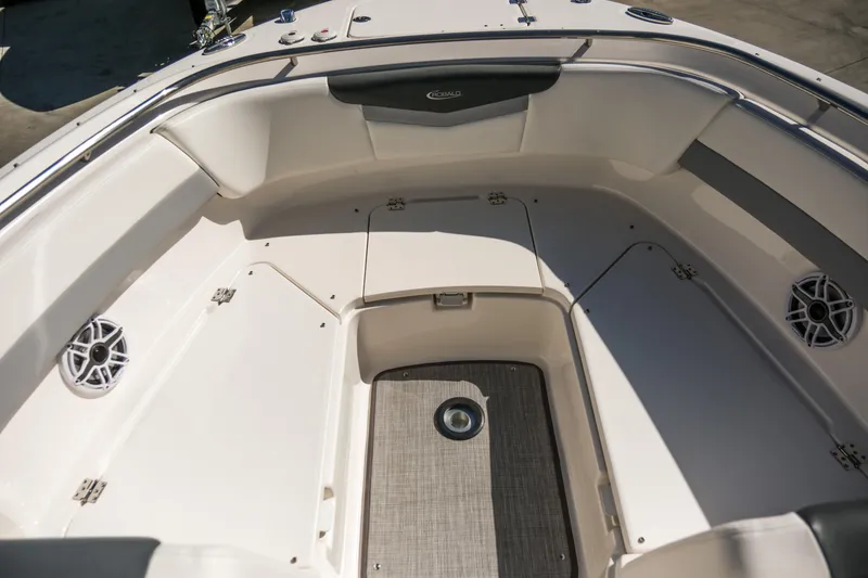 Slide: The Image of 2022 Robalo R247 DC boat interior with seating and storage compartments. - 5