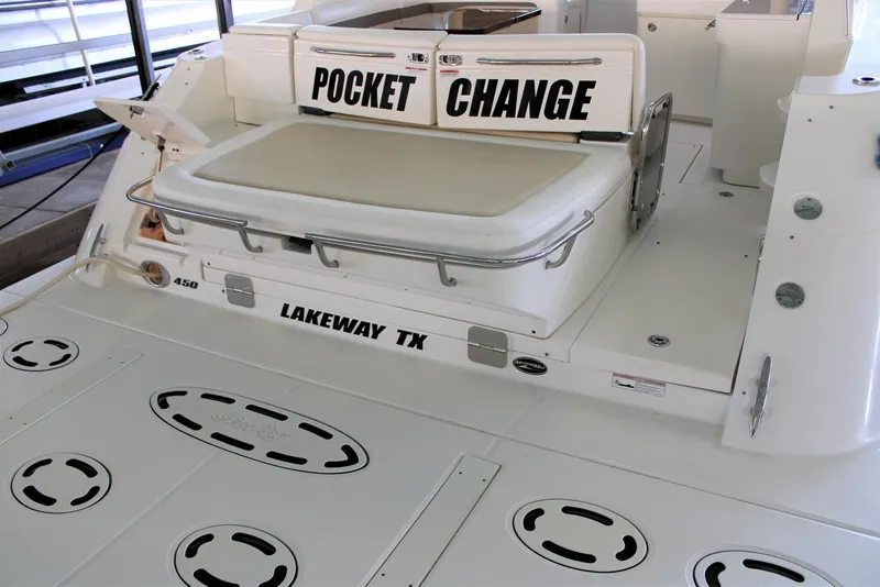 Slide: The Image of 2012 Sea Ray 450 Sundancer boat deck with seating, labeled "Pocket Change," in Lakeway, TX. - 18