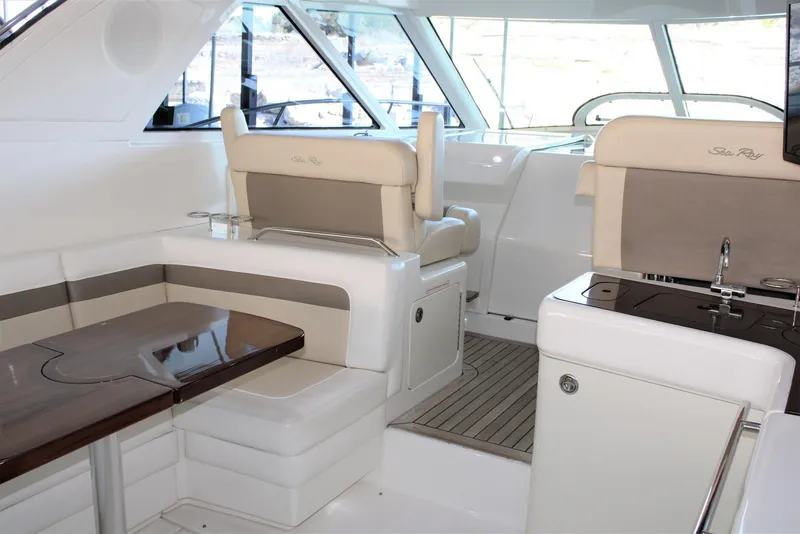 Slide: The Image of Interior of 2012 Sea Ray 450 Sundancer yacht with seating and kitchenette. - 20