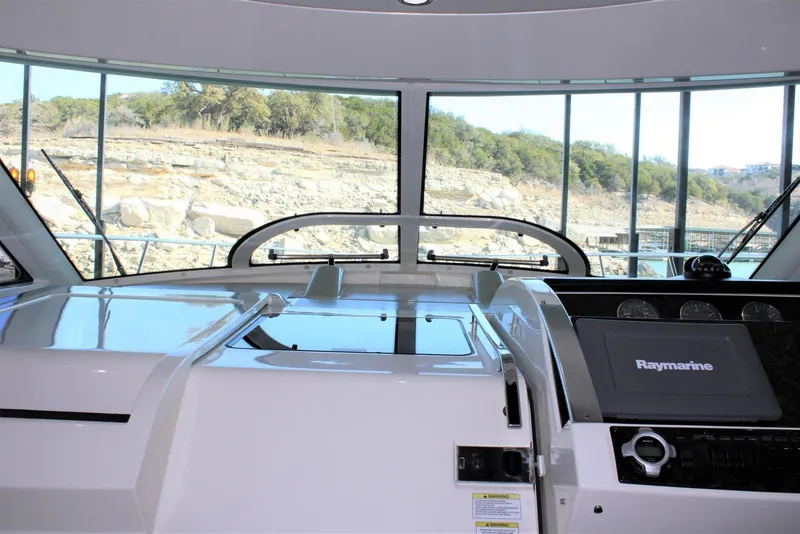 Slide: The Image of Interior view of 2012 Sea Ray 450 Sundancer yacht with Raymarine navigation system. - 38