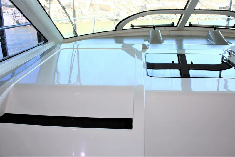 Slide: The Image of 2012 Sea Ray 450 Sundancer yacht interior with sleek, modern design and large windows. - 39