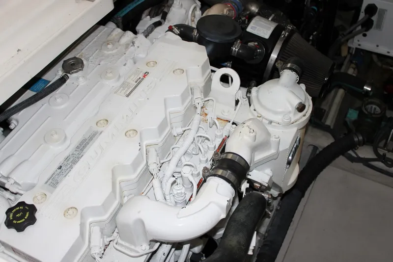 Slide: The Image of Engine compartment of 2012 Sea Ray 450 Sundancer with Cummins marine engine. - 48
