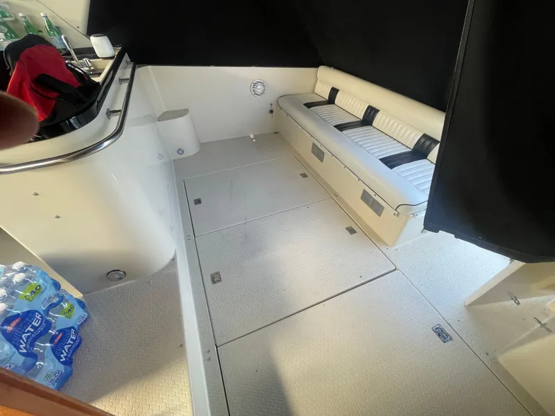 Slide: The Image of 1988 Californian express cruiser interior with seating and bottled water. - 11