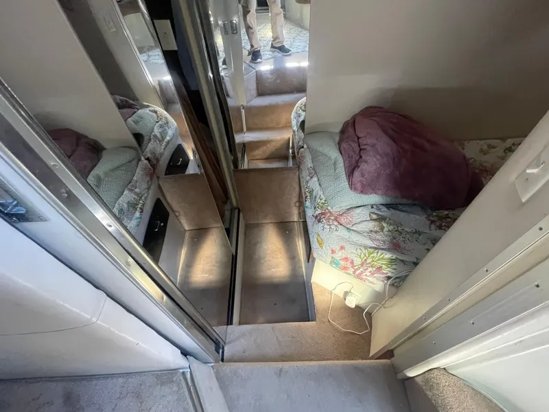 Slide: The Image of Interior of 1988 Californian express cruiser with cozy bed and mirrored walls. - 18