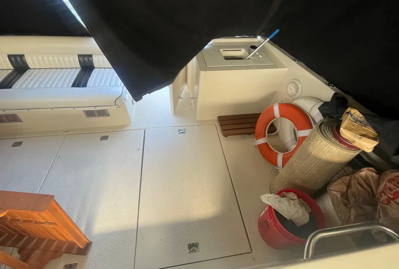 Slide: The Image of 1988 Californian express cruiser interior with seating, life preserver, and storage items. - 3