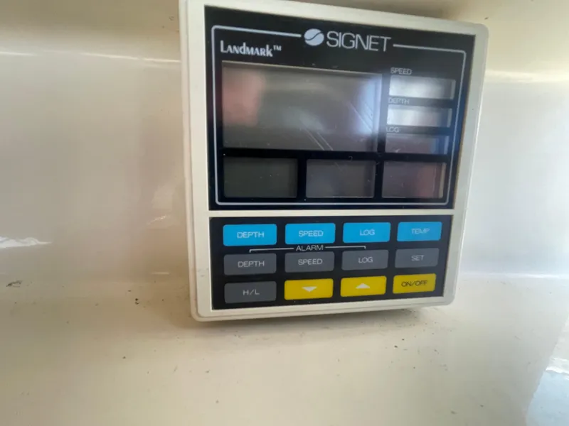 Slide: The Image of 1988 Californian express cruiser control panel with Signet display and various function buttons. - 30