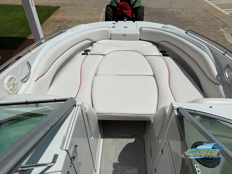 Slide: The Image of 2006 Crownline 260 EX boat interior with white seating and red accents. - 11