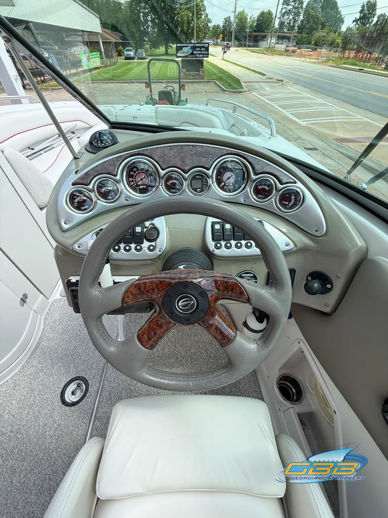 Slide: The Image of 2006 Crownline 260 EX boat dashboard with steering wheel and instrument panel. - 15