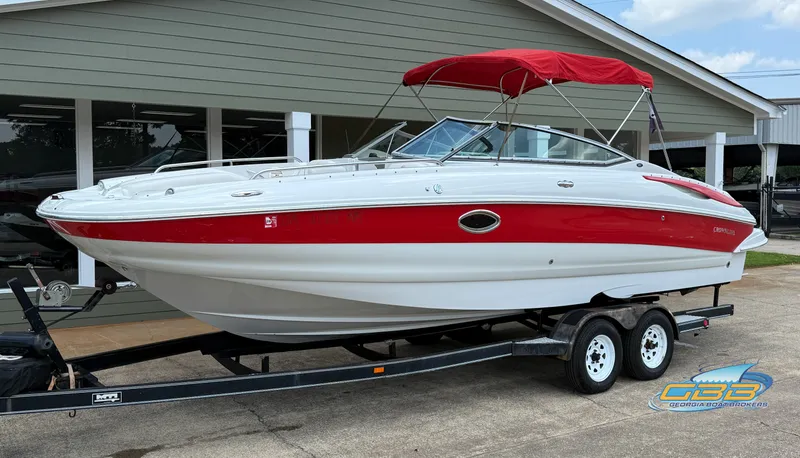 Slide: The Image of 2006 Crownline 260 EX boat with red and white design on trailer. - 5