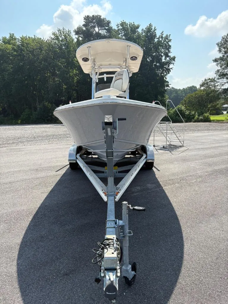 Slide: The Image of 2021 Sea Chaser 23 LX boat on trailer, parked outdoors, sunny day. - 13