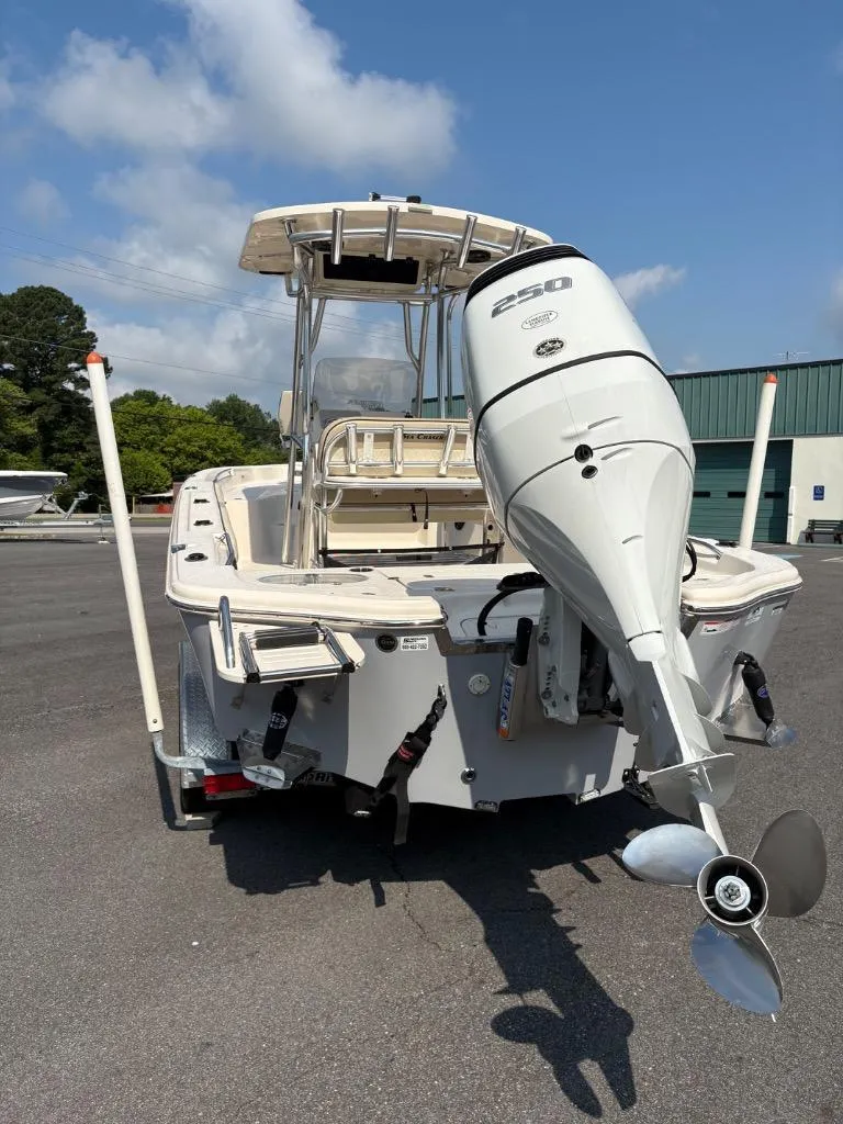 Slide: The Image of 2021 Sea Chaser 23 LX boat with powerful outboard motor, parked on a trailer. - 15