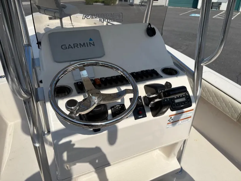 Slide: The Image of 2021 Sea Chaser 23 LX boat console with Garmin navigation and steering wheel. - 18