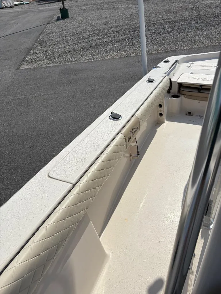 Slide: The Image of 2021 Sea Chaser 23 LX boat interior with quilted seating and clean deck. - 21
