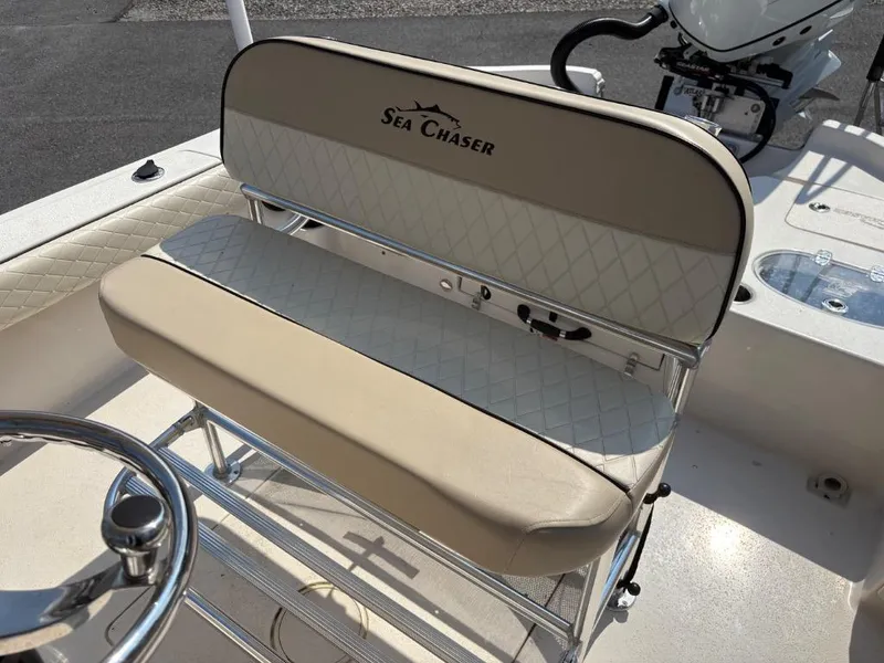 Slide: The Image of 2021 Sea Chaser 23 LX boat seat with beige upholstery and diamond pattern. - 23