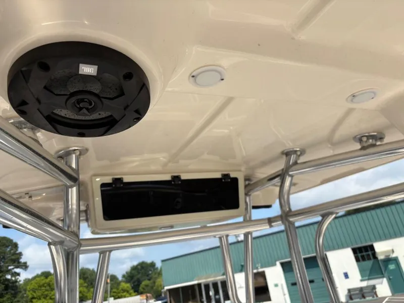 Slide: The Image of 2021 Sea Chaser 23 LX boat T-top with speaker and rod holders. - 24