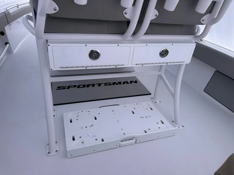 Slide: The Image of 2025 Sportsman Masters 247OE Bay Boat interior with storage drawers and seating. - 16