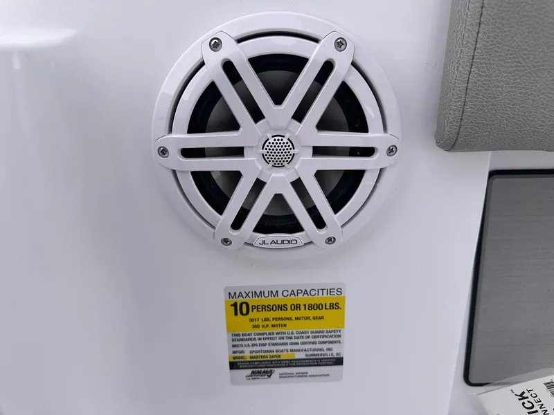 Slide: The Image of Speaker and capacity label on 2025 Sportsman Masters 247OE Bay Boat. - 17