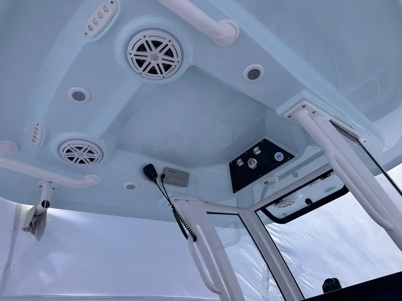 Slide: The Image of 2025 Sportsman Masters 247OE Bay Boat interior with speakers and control panel. - 18