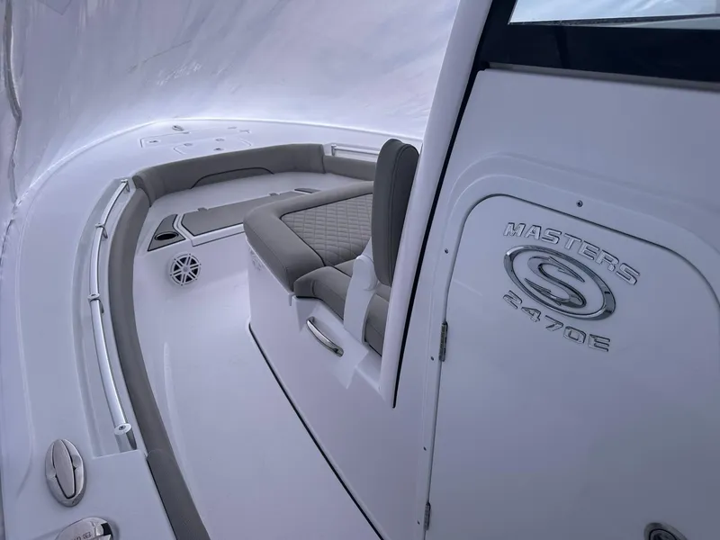 Slide: The Image of 2025 Sportsman Masters 247OE Bay Boat interior with sleek seating and modern design. - 19