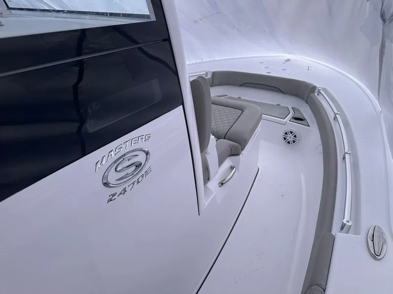 Slide: The Image of 2025 Sportsman Masters 247OE Bay Boat interior with seating and logo detail. - 20