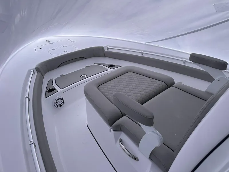 Slide: The Image of 2025 Sportsman Masters 247OE Bay Boat interior with cushioned seating and sleek design. - 21