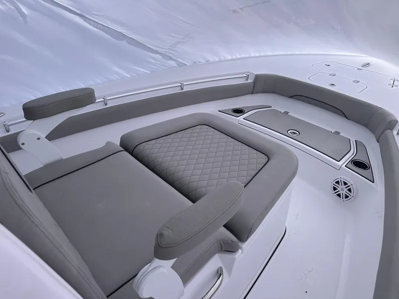 Slide: The Image of 2025 Sportsman Masters 247OE Bay Boat interior with cushioned seating and modern design. - 22