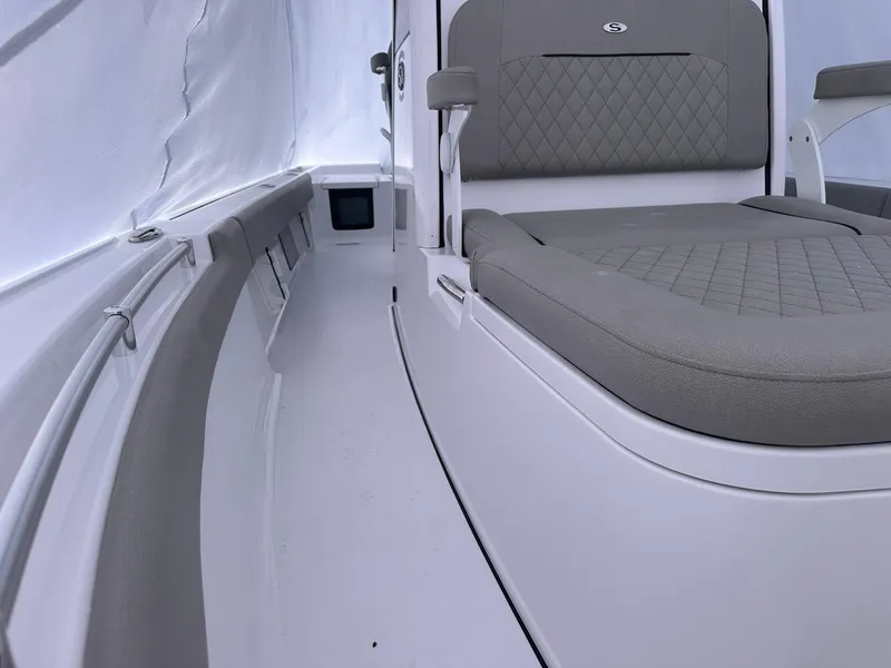 Slide: The Image of 2025 Sportsman Masters 247OE Bay Boat interior with cushioned seating and sleek design. - 30