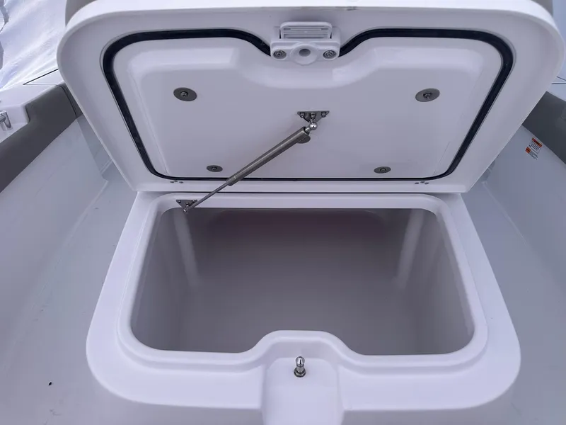 Slide: The Image of Open storage compartment on 2025 Sportsman Masters 247OE Bay Boat. - 32