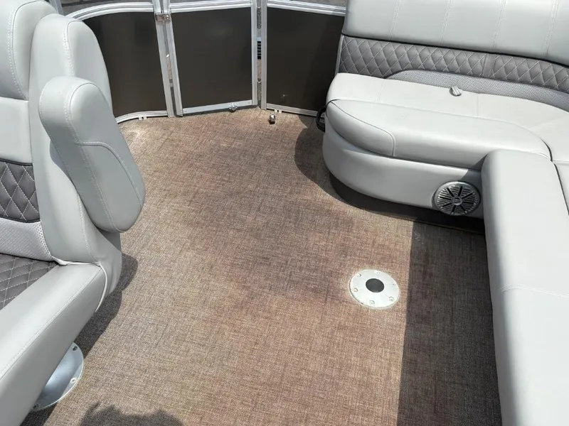 Slide: The Image of Interior of 2022 Ranger Reata 223C boat with gray seating and carpeted floor. - 8