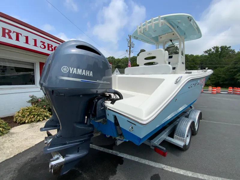 Slide: The Image of 2023 Cobia 240 Center Console boat with Yamaha engine on trailer. - 10