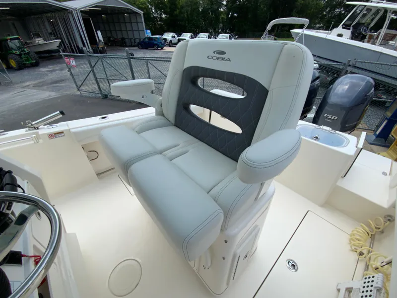 Slide: The Image of 2023 Cobia 240 Center Console boat seat with armrests and diamond-patterned upholstery. - 15
