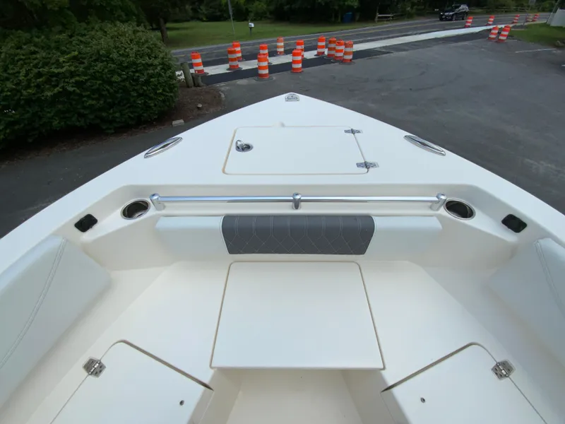 Slide: The Image of 2023 Cobia 240 Center Console boat interior with seating and storage compartments. - 24