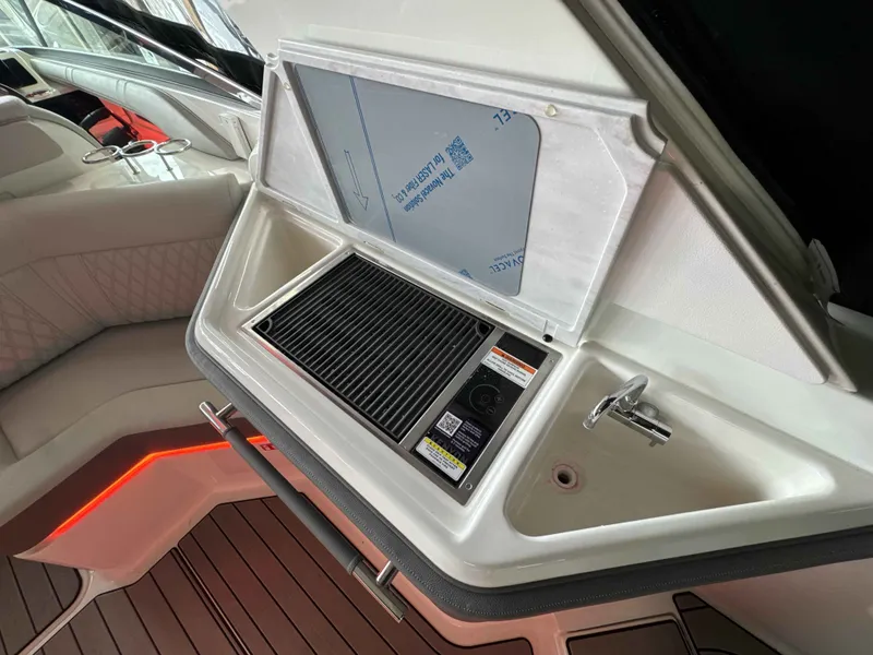 Slide: The Image of Interior of 2026 Sea Ray SLX 310 with grill and sink. - 25