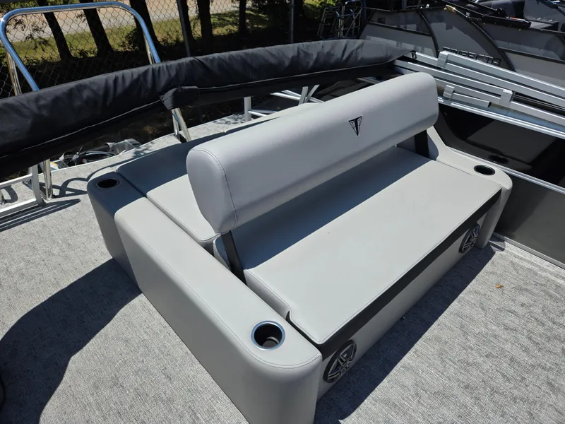 Slide: The Image of 2025 Trifecta 24 UL LET2.75 boat seating with cup holders and speakers. - 9