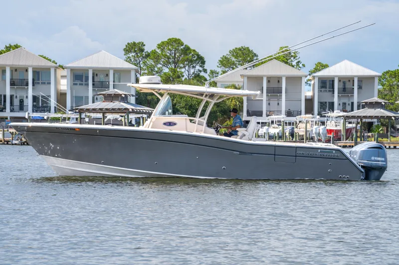 Slide: The Image of 2017 Grady-White 336 Canyon boat on water near waterfront homes. - 10