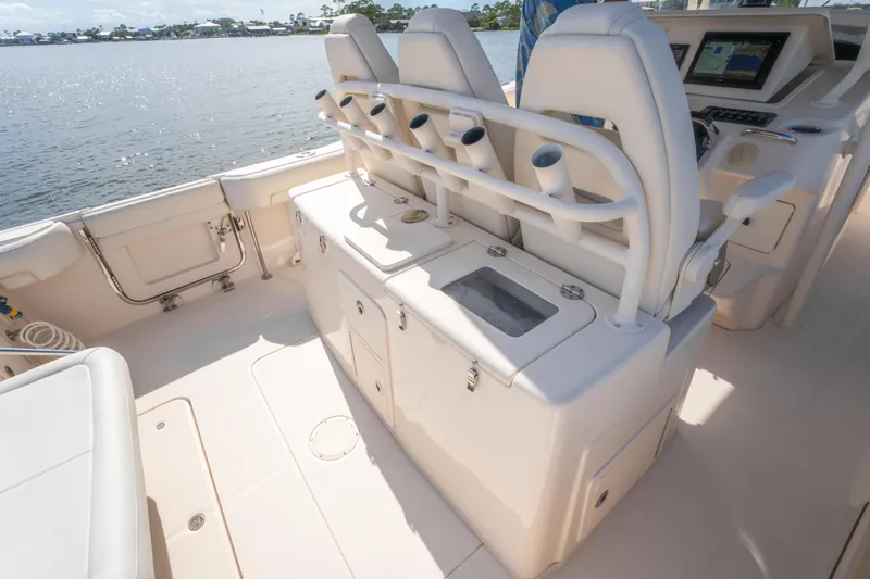 Slide: The Image of 2017 Grady-White 336 Canyon boat interior with seating and control panel, overlooking water. - 19