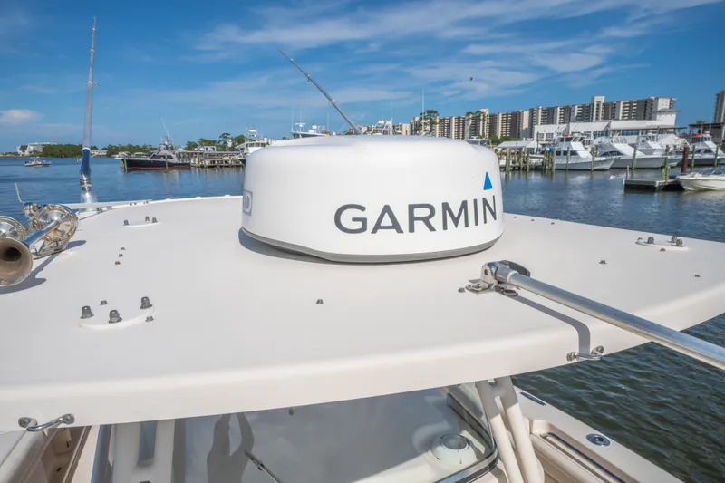 Slide: The Image of 2017 Grady-White 336 Canyon boat with Garmin radar, docked in a marina. - 32